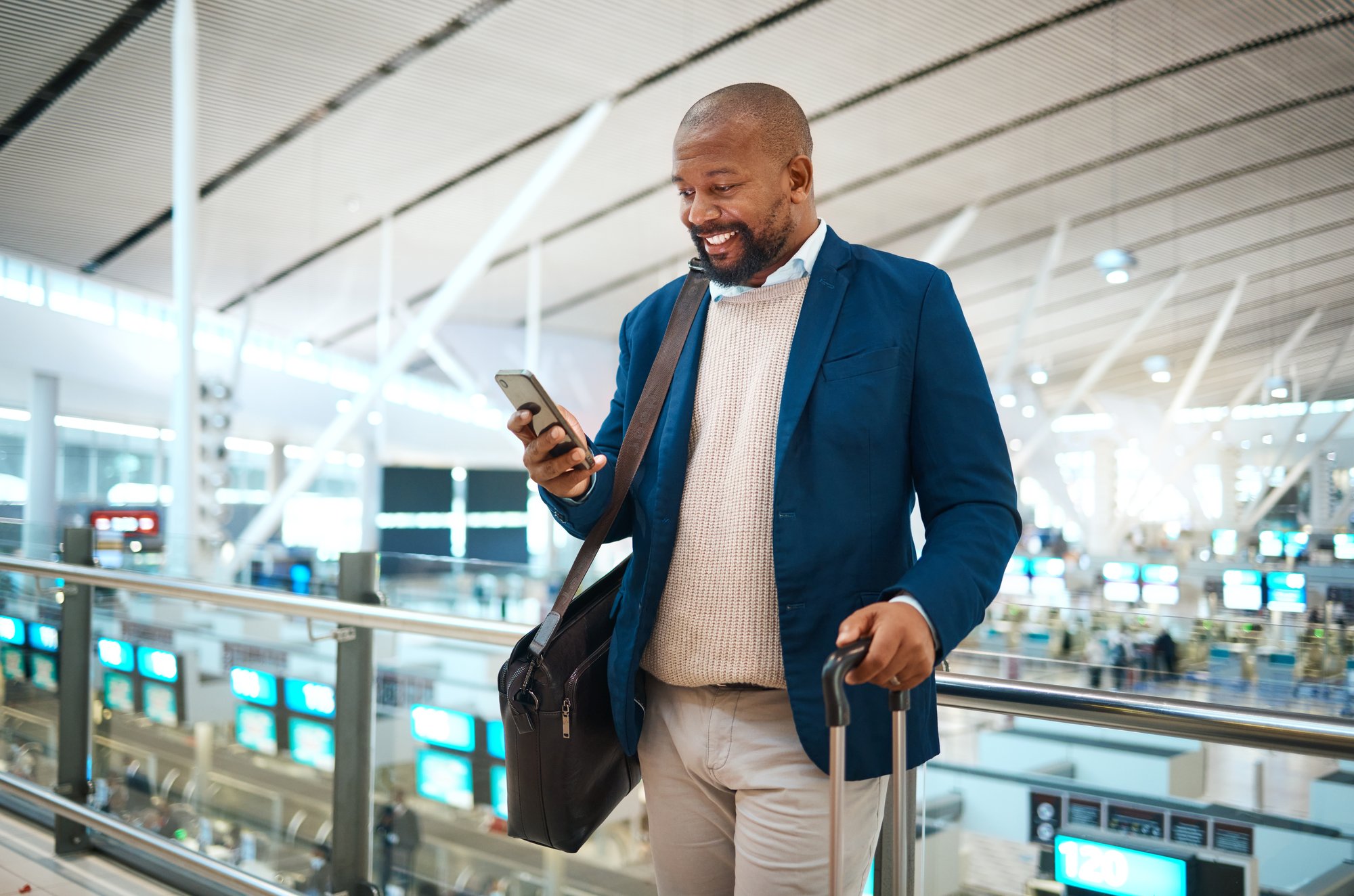 black-man-with-phone-airport-and-online-check-in-2023-02-25-00-23-54-utc