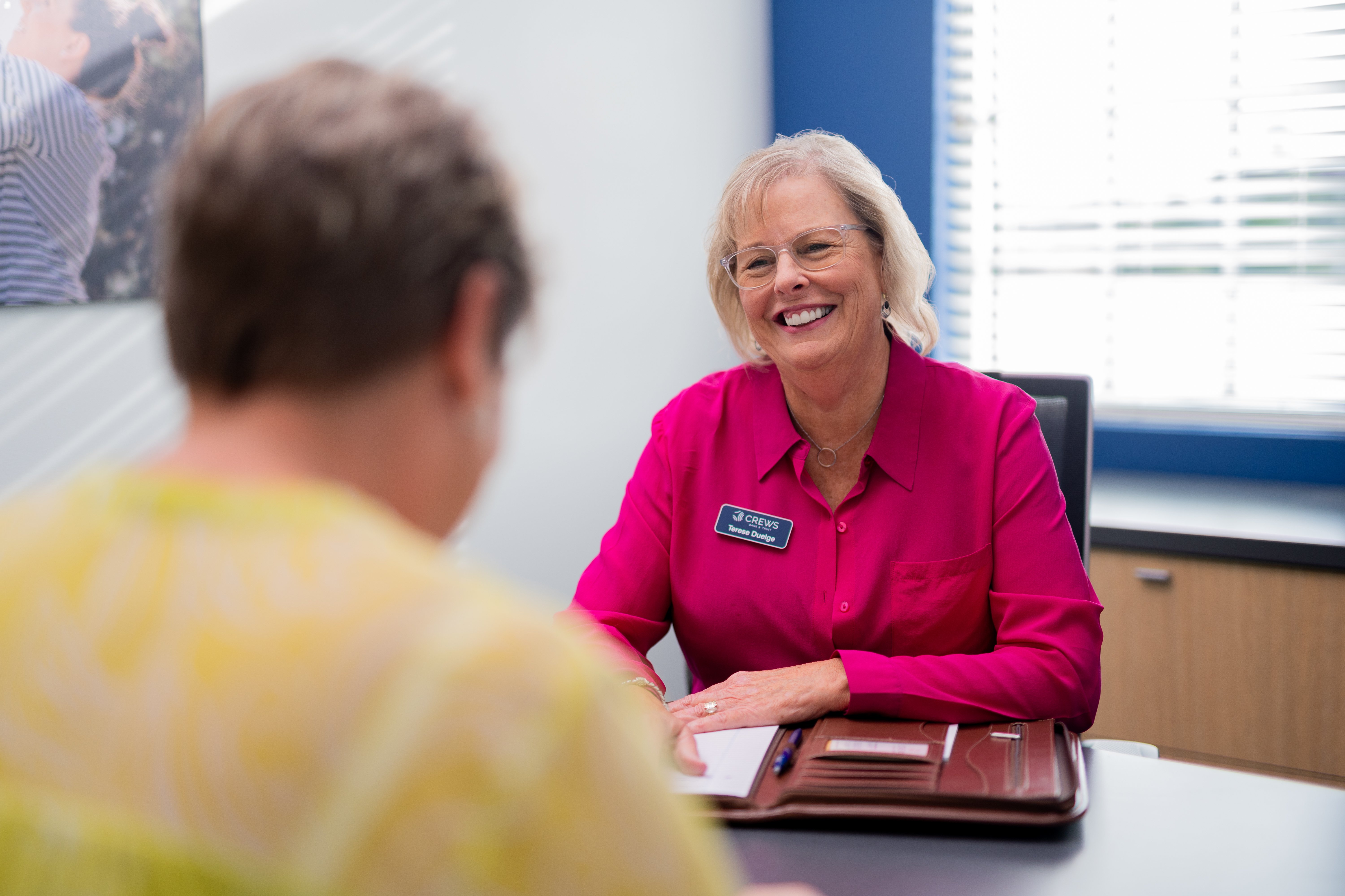 smiling lending specialist with mortgage customer