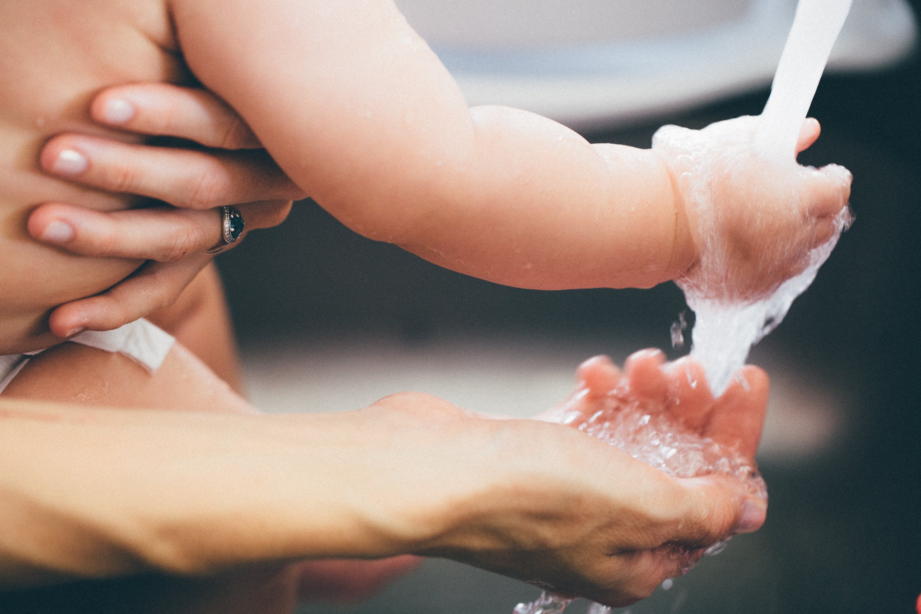 mother and baby washing their hands