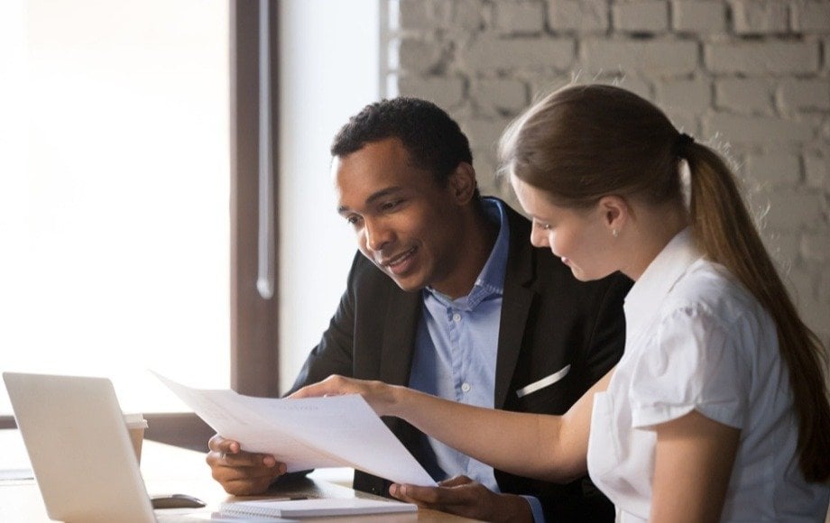 woman and man looking over paperwork