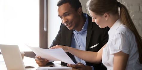 Man and woman looking at paperwork 