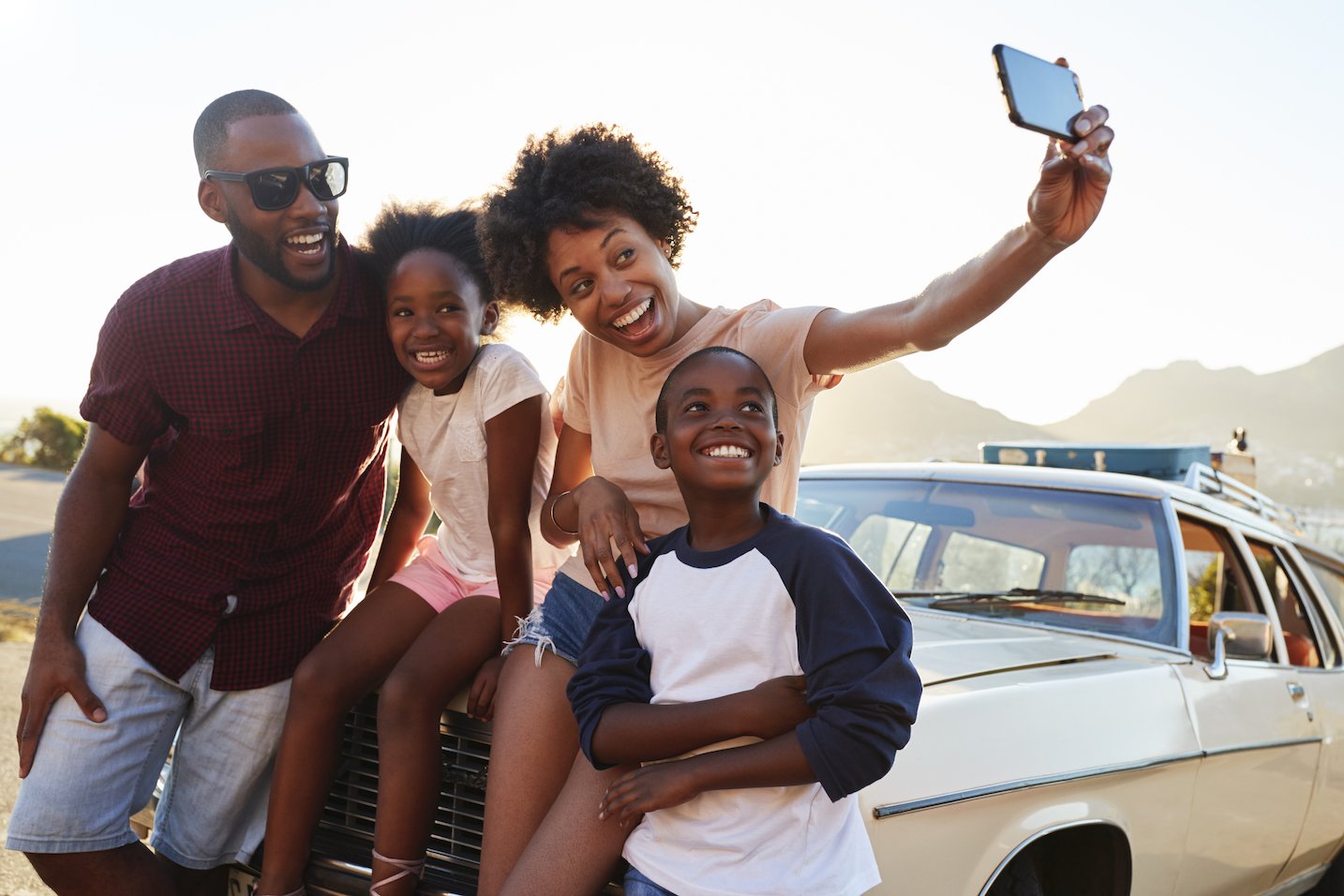 Family taking a group selfie