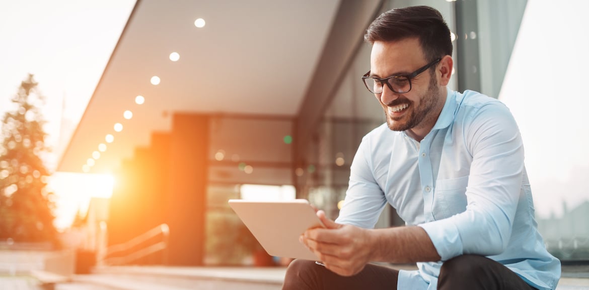 man using table to make online investments