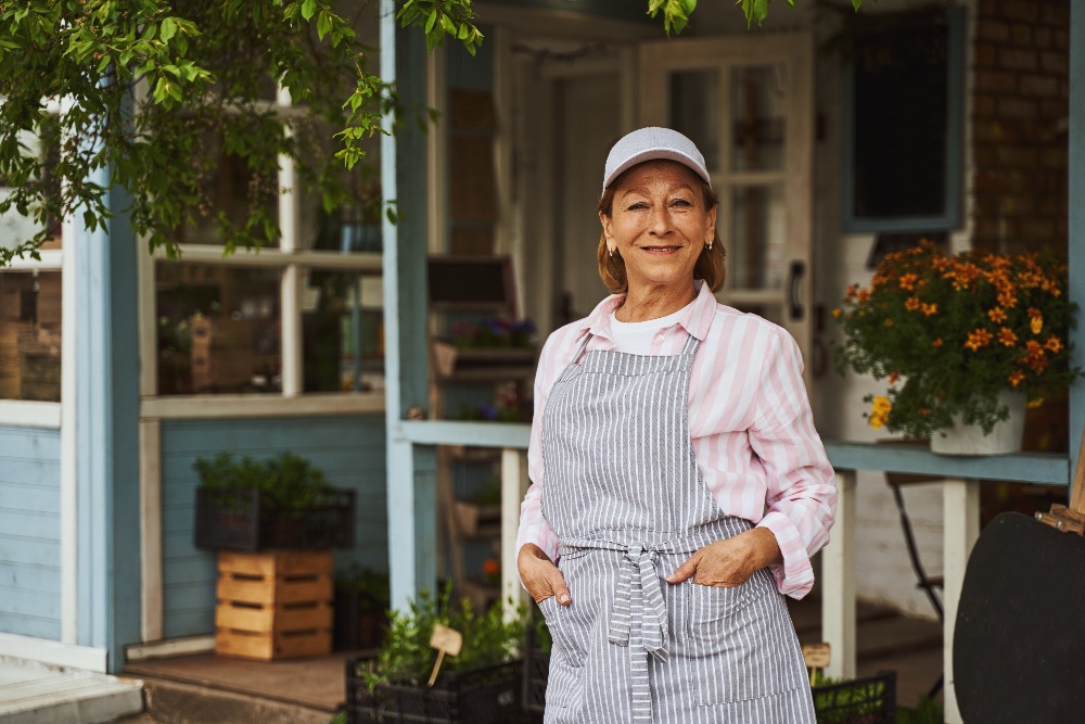 merry-mature-female-near-rural-flower-shop-2023-11-27-05-22-21-utc-1