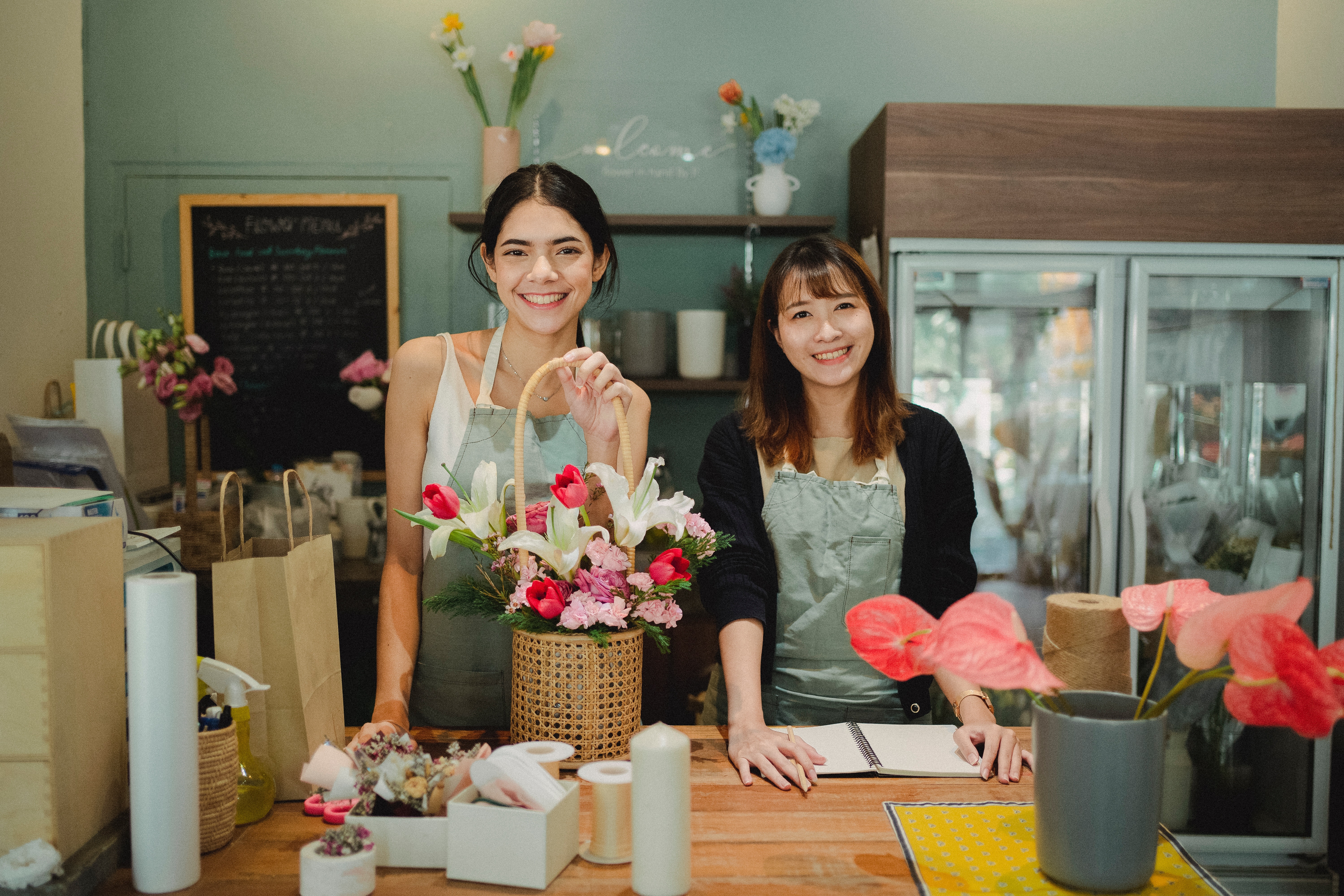 Two women at the counter of their business