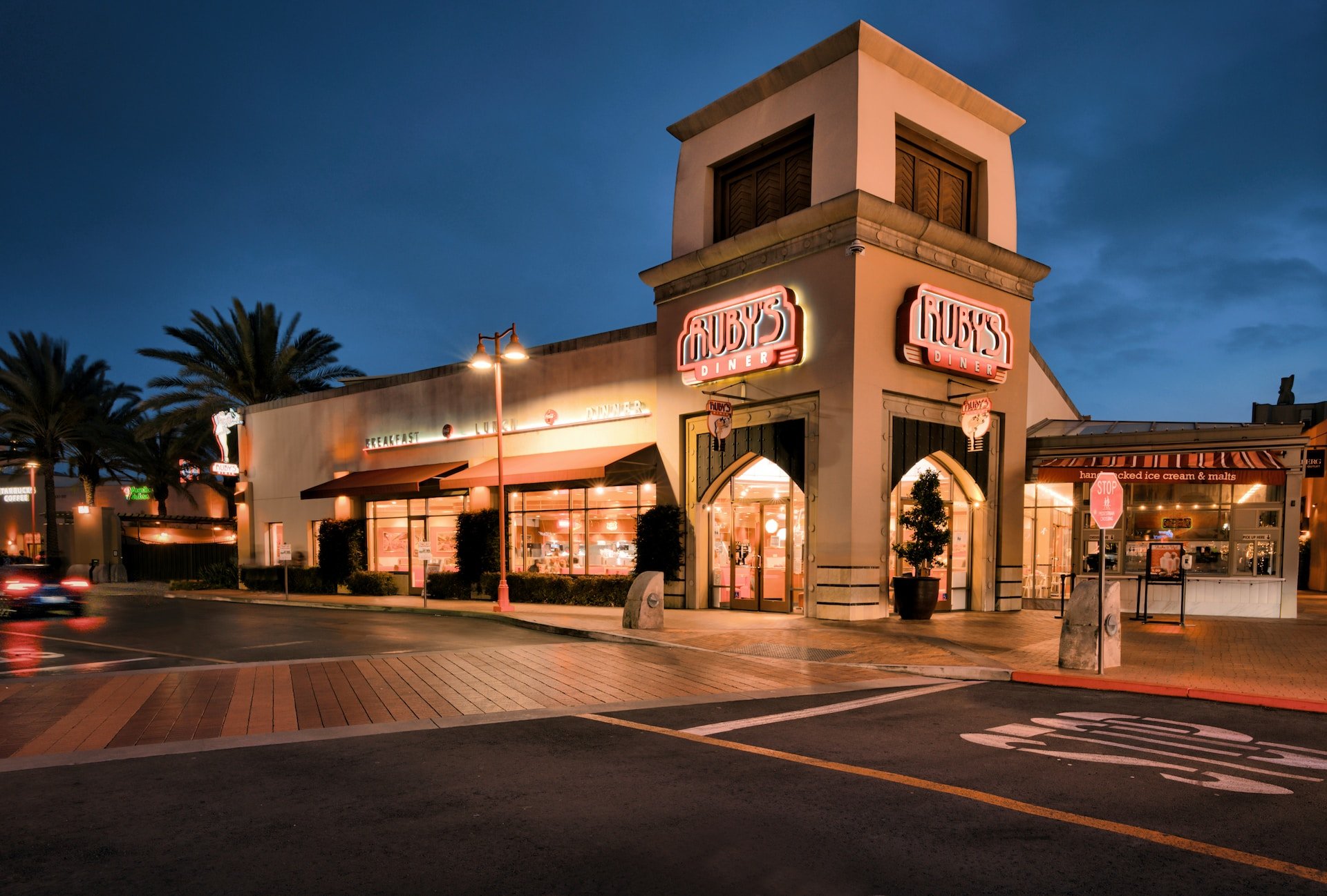 image of Ruby's Diner in strip mall at night