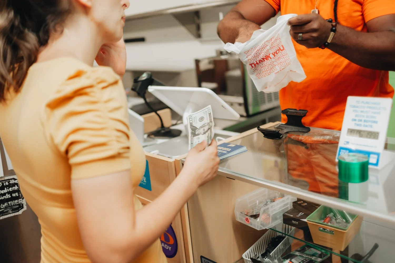 young millennial woman shopping at a local store (web)